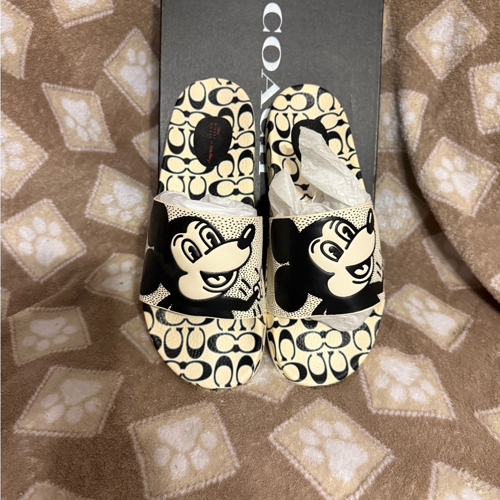 Coach Women’s One Piece Black and Cream Character Slides